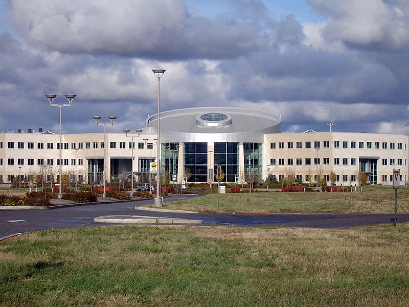 A three-storey academic building sits on a large lawn. (Terrace Building, U of Regina)