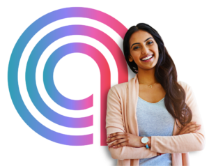 A smiling young South Asian woman with long wavy hair wearing casual clothing stands with crossed arms in front of a stylized, multicolour spiral.