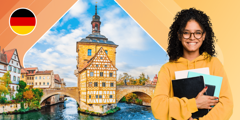 A young woman carrying a tablet and notebooks stands in front of a German canal with a tower at its centre.