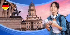 A young woman wearing headphones and a backpack, and carrying a phone and a disposable coffee cup is framed by the German flag and two impressive stone buildings with ornate sculptures at twilight.