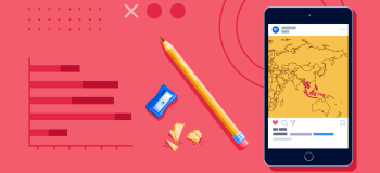 A smartphone showing a map of Southeast Asia and some school supplies