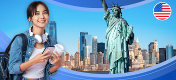 A picture of a female international student holding a coffee cup and phone while wearing a backpack, standing in front of a blue illustration banner that features a picture of New York and the Statue of Liberty