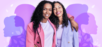 Two women with curly hair and pastel pink and purple blazers stand with their arms around each other's shoulders. They are framed by semi-transparent silhouettes, each of a different women's profile, in shades of purple.