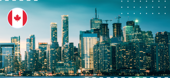 A photo of a Canadian city with a graphic of a Canadian flag in the top left corner.