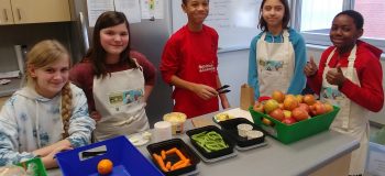 Young students with healthy food