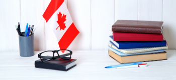 Items on desk with Canada flag