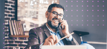 A photo of a man at his desk.
