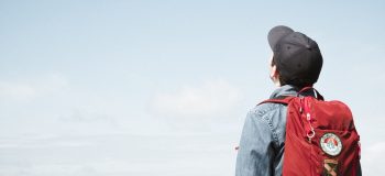 Student looking up at sky