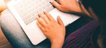 Person typing on laptop