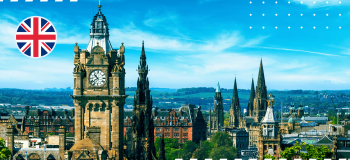 A photo of a city in the United Kingdom with the UK flag illustration in the top left corner.
